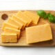 Piece and slices of cheddar cheese